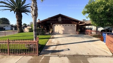 Building Photo - 3 bedroom 2 bathroom home on a corner lot with extra fenced parking.