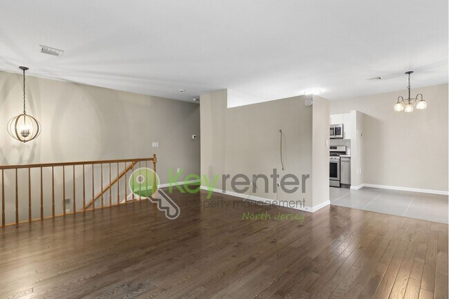 Building Photo - Spacious 2BR/2BA Duplex in Gated Community with Parking, Washer/Dryer & NYC Skyline Views