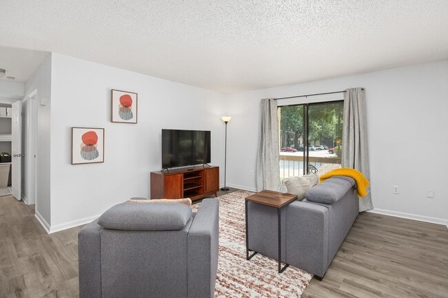Building Photo - Furnished 1-Bedroom Condo with Modern Upda...
