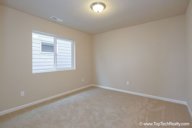 Building Photo - Spacious 4-Bedroom + Office Home in Abbey Creek – Modern Finishes, EV Charger & Low-Maintenance B...