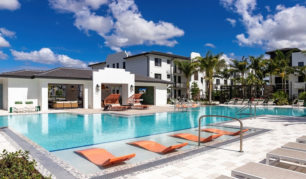 Relax by the shimmering pool at your new community - Solea at Miami Lakes