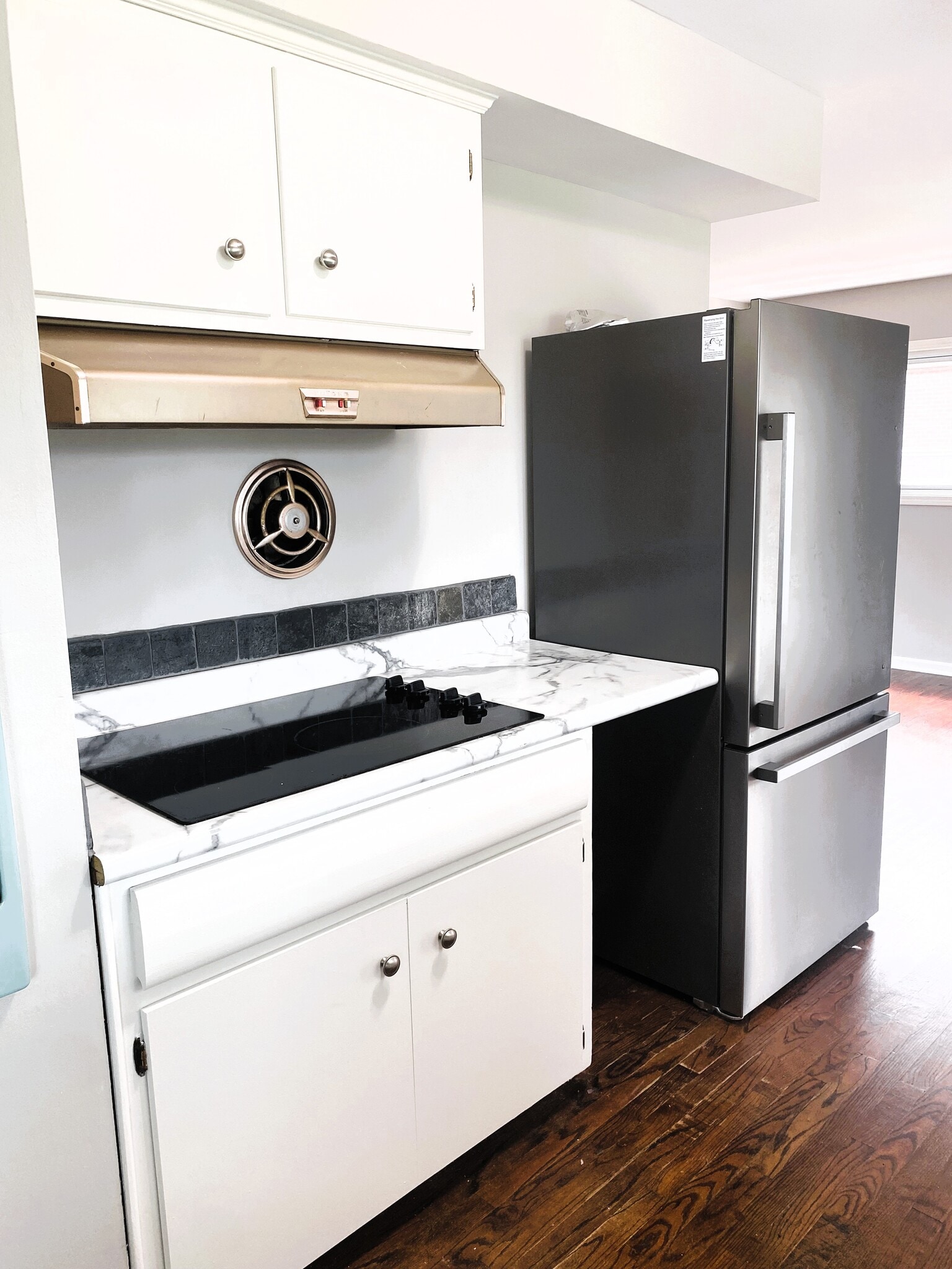 Cook top and new stainless steel refridgerator. - 1611 Ludean Dr