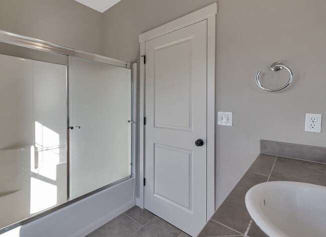 Building Photo - 2BR + 2.1BA Corner Townhome-Style Condo — Dual Primary Suites, Attached Garage & Most Utilities I...