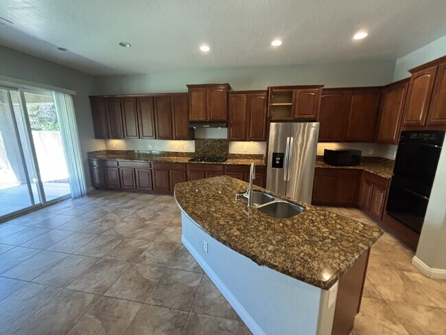 Building Photo - 5-Bed Retreat with Granite Elegance & Cozy Fireplace – 3690 Sq Ft of Comfort in Las Vegas with a ...