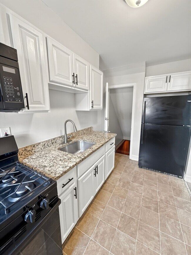 Building Photo - Spacious Dundalk Home with Finished Basement & Fireplace