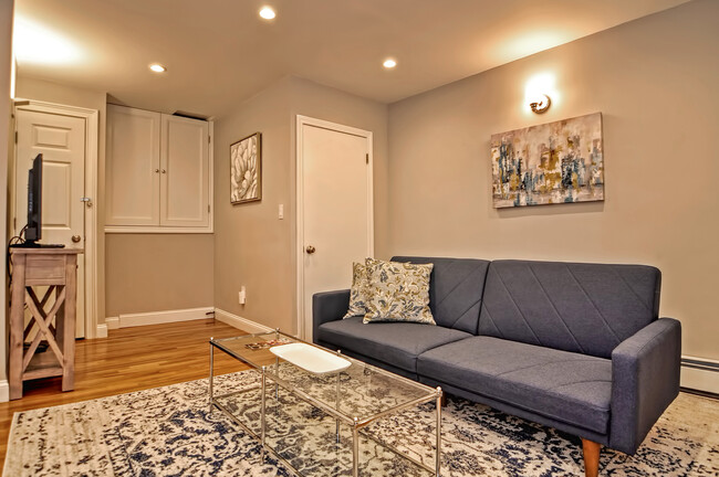 Lower level living room with extra sleeping space - 46 Cedar Lane Way