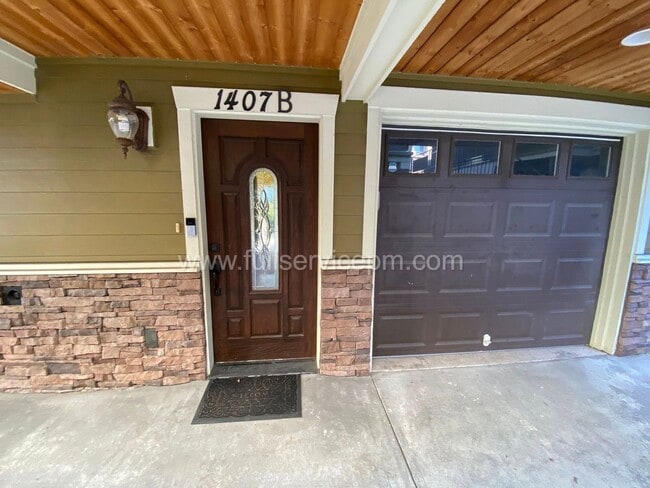 Building Photo - Spacious townhome with private backyard, garage parking, multiple decks, and a dedicated home off...