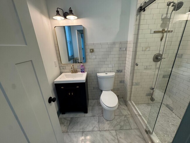 Building Photo - Modern Bungalow Charm: Designer Finishes & Expansive Backyard Living!