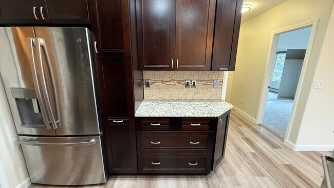 Building Photo - Major Updates! Raised Ranch Style Condo wi...