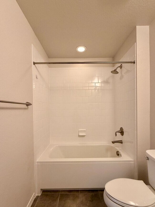 Building Photo - Move-In Ready 3-Story Townhome with Loft & 2-Car Garage