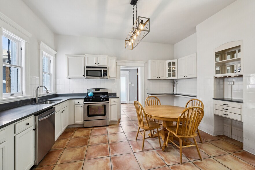 Large Eat in Kitchen includes gas stove, microwave, dishwasher and ample storage - 1118 Colquitt Ave NE