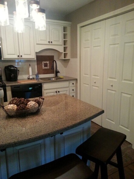 Full sized Whirlpool washer/dryer in laundry pantries in kitchen - 917 SE 3rd St