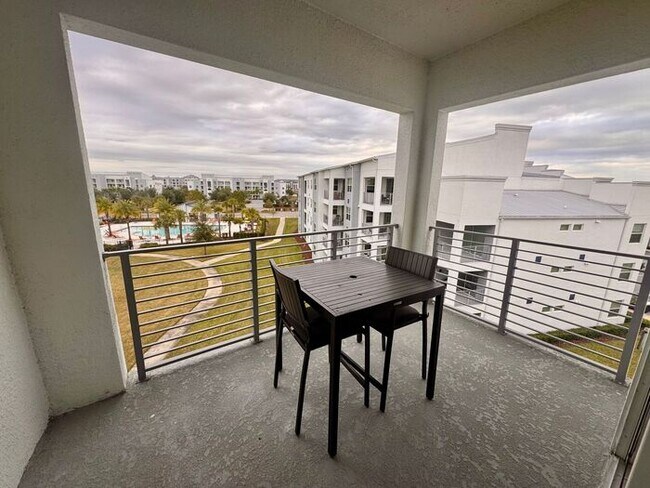 Building Photo - Fully Furnished 2/2 Luxury Storey Lake Condo near Disney with a Stunning Balcony Viiew!