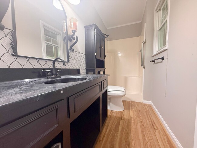 Building Photo - Spacious 3-Bedroom Home with Screened Porch, 2-Car Garage + Workshop