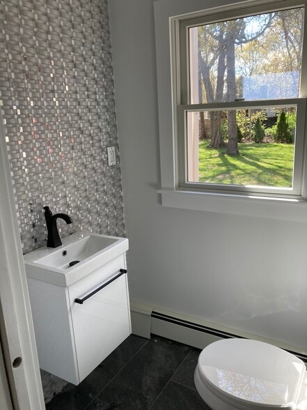 First floor half bath with W/D hookup - 2 Sea Pines Ln