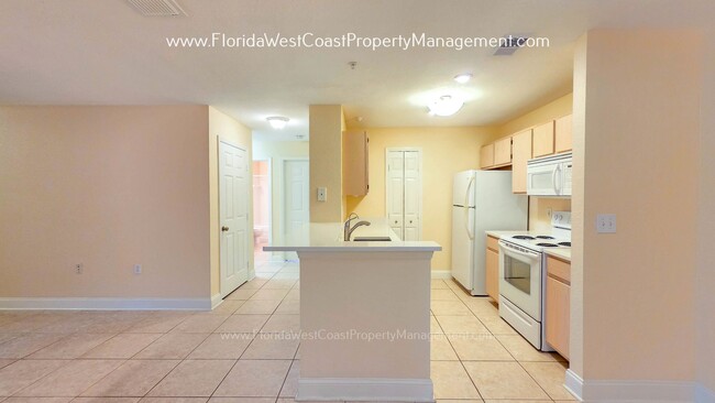 Building Photo - MOVE IN READY! LARGE 2 BEDROOM/2 BATH PLUS ATTACHED GARAGE! TILE/LVP THROUGHOUT!