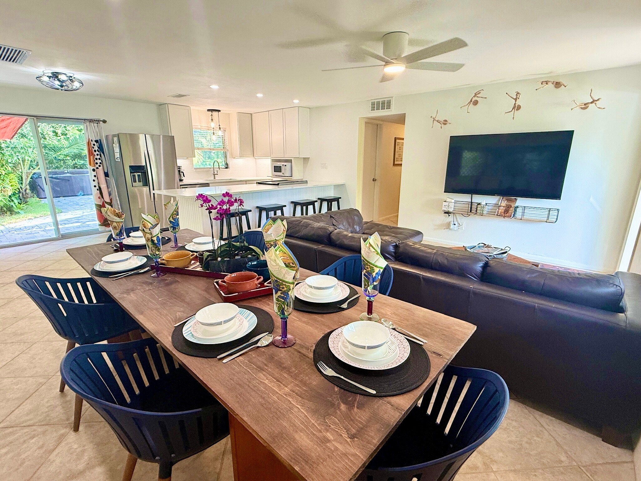 OPEN CONCEPT LIVING / DINING/ KITCHEN AREA Sofa & table for 6 & 65-inch 4K UHD Roku Smart TV - 465 8th St N