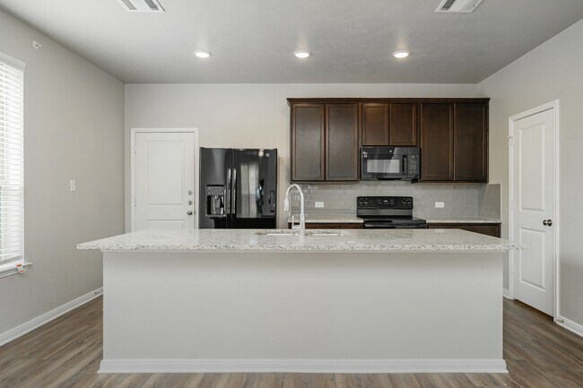 Building Photo - Spacious Townhome Available Now!