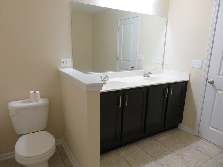 Master Bath double sink espresso vanity, toilet, & tile flooring - 2496 Stadium Dr