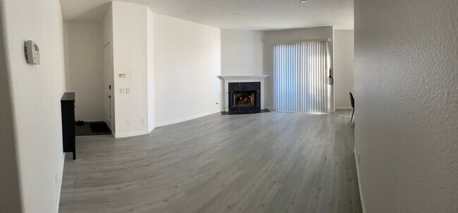 Living room and fireplace - 21832 S Vermont Ave