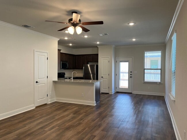 Building Photo - Move Fast! Gated Townhome Near Lackland AFB with Private Yard & EV-Ready Garage