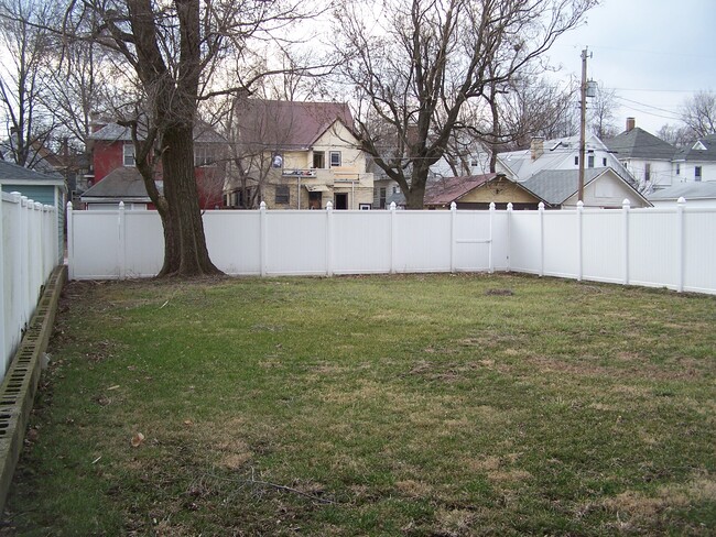 The back yard. Parking is behind the fence through the gate. - 1525 South 7th Street