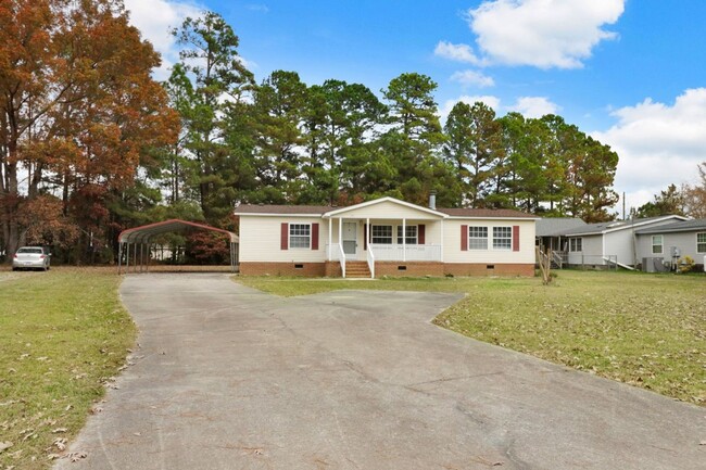 Building Photo - Fresh & Clean! 3 BR, 2 BA Home w/ Carport ...