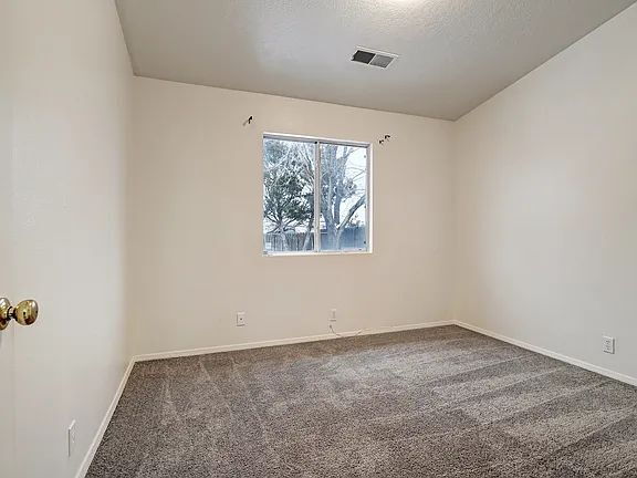 Building Photo - "Spacious 4-Bedroom Gem on Quartz Dr – Your Ideal Albuquerque Retreat!"
