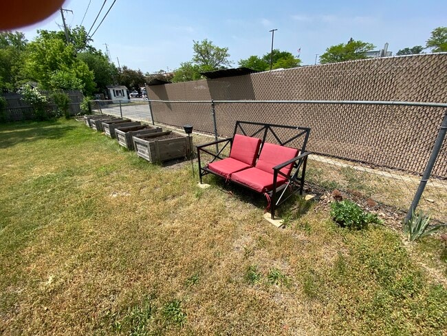 Garden boxes and smoking area in back yard. - 309 N Davison St