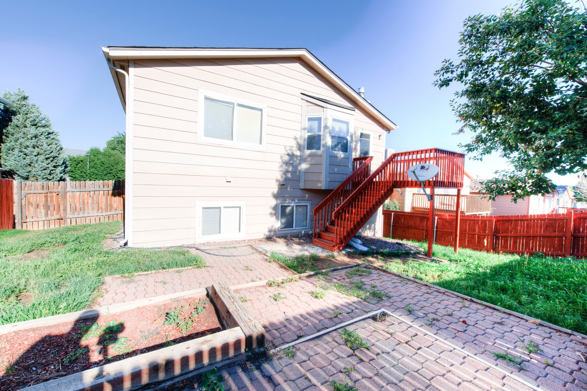 Back yard patio has an apple tree and a vegatable garden. - 2875 Richmond Dr
