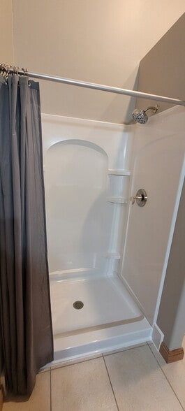 New step in shower - 520 W 1st St