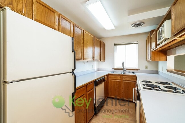 Building Photo - **Rent Special** Remodeled Two-Bedroom with Open Floor Plan, Parking, and Easy Transit Access