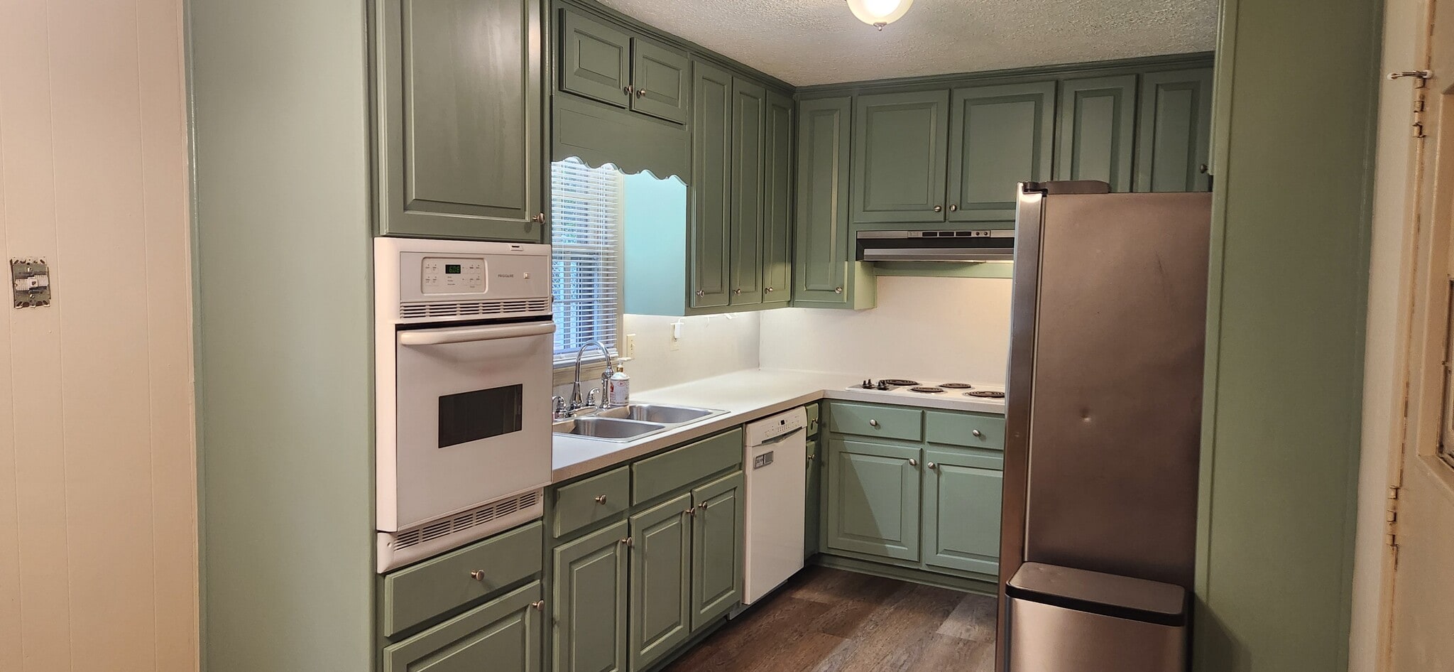 Freshly painted kitchen with new cabinet doors - 5787 Lorraine Dr