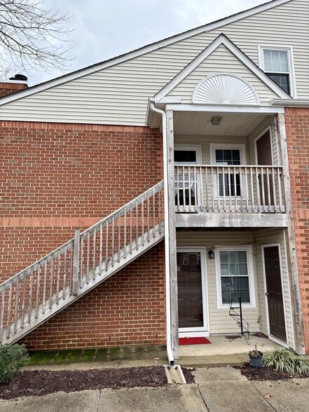 Exterior stairs lead to your new home! - 208 Quarter Trl