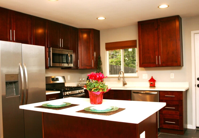 Modern kitchen with stain appliances - 5019 W 34th Ave