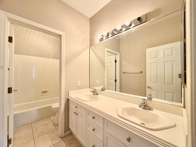 Building Photo - GATED SUMMERLIN HOME | 5 BEDROOM + DOWNSTAIRS DEN | 3-CAR GARAGE