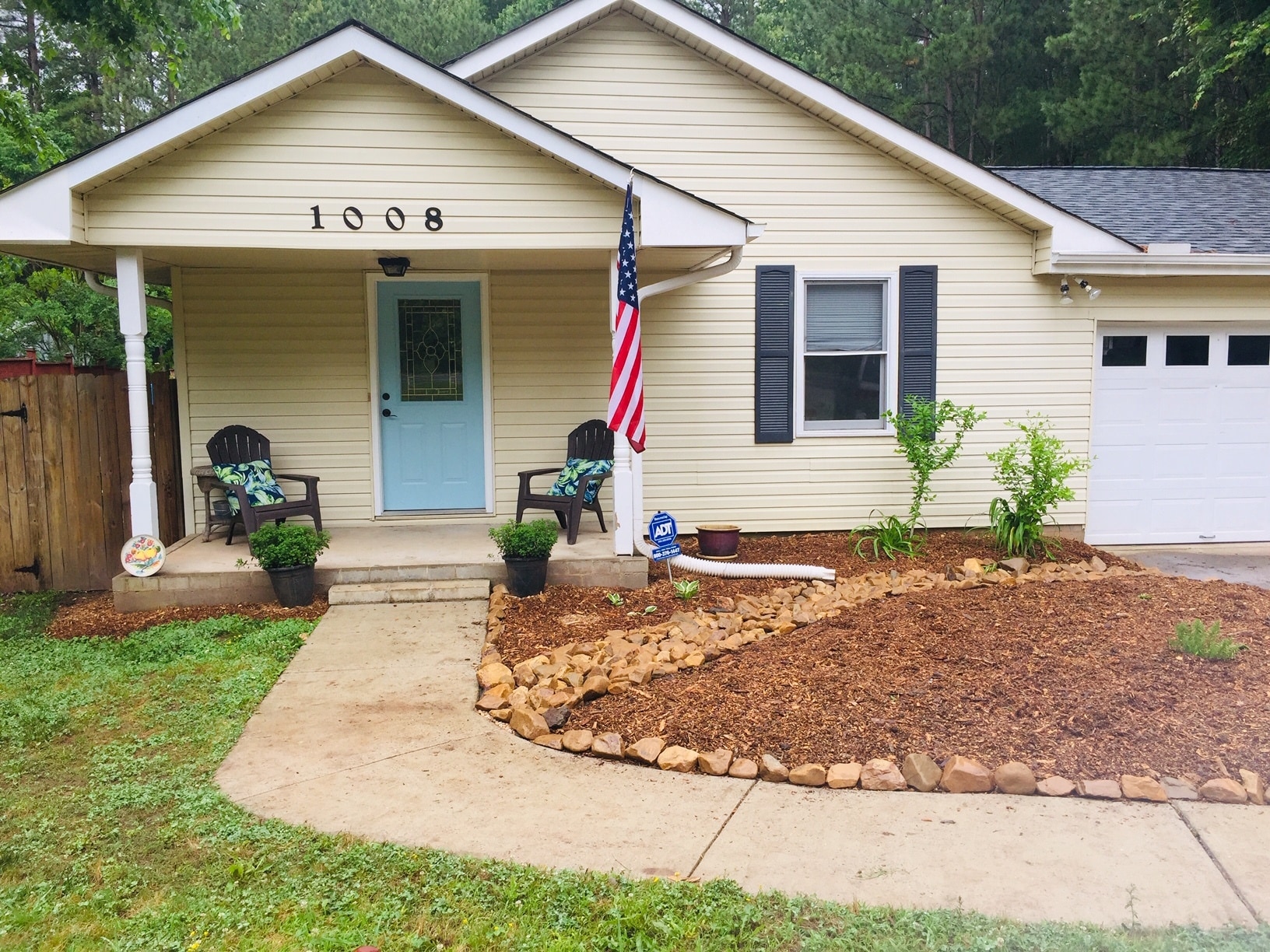 Recently landscaped front bed with a dry creek bed. - 1008 Carpenter Fletcher Rd