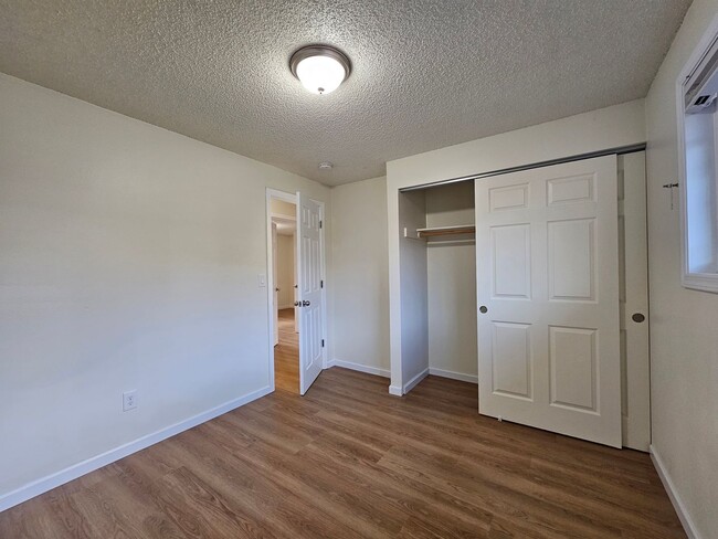 Building Photo - Charming Single-Level Home Featuring New Hardwood Floors, Bright Bedrooms & Open-Concept Living