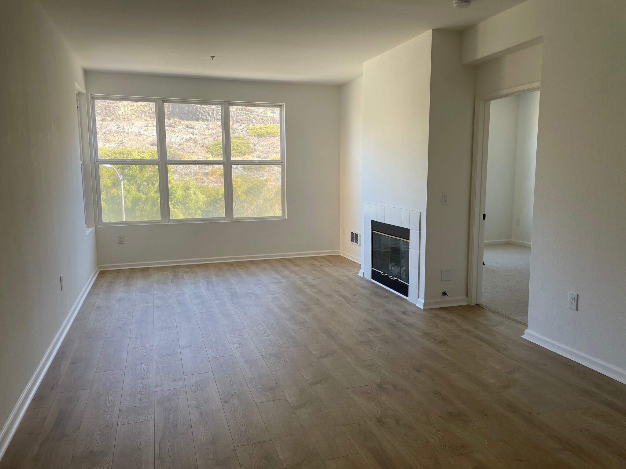 Bright living room with views of a peaceful hillside - 1 Crescent Way