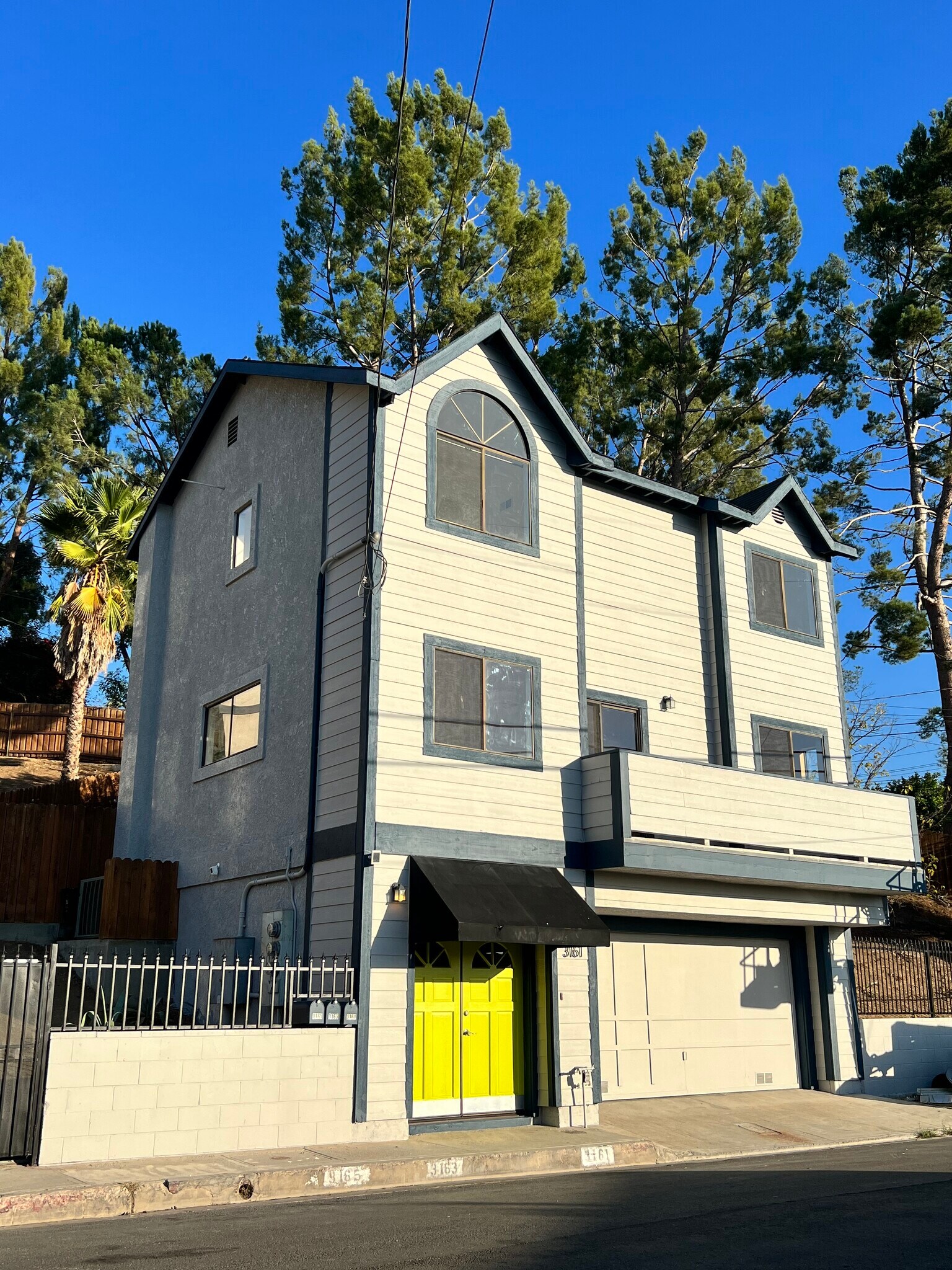 New exterior paint with citron green doors - 3161 Weldon Ave