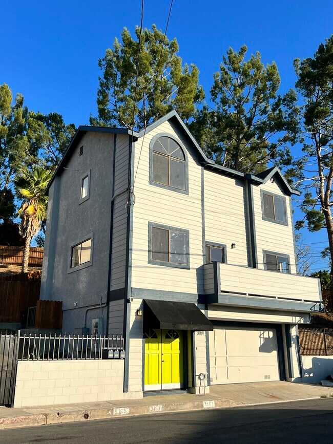 New exterior paint with citron green doors - 3161 Weldon Ave