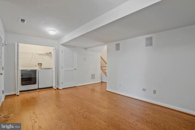 Building Photo - This beautifully maintained brick-front, three-level townhome is located in a highly sought-after...