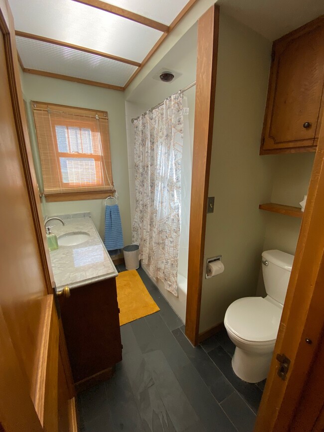 Upstairs bathroom with tub and shower - 719 Pine St