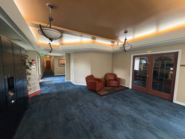 Building Photo - Bright, Modern 1BR Near Hospitals, SU & Transit in secure building with garage parking and a Walk...