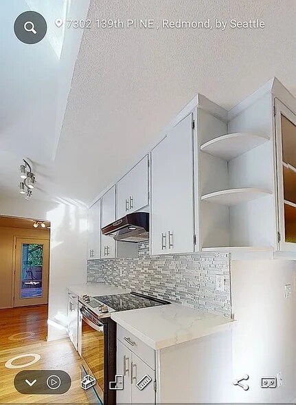 Remodeled kitchen with new stove and hood - 7302 139th PL NE
