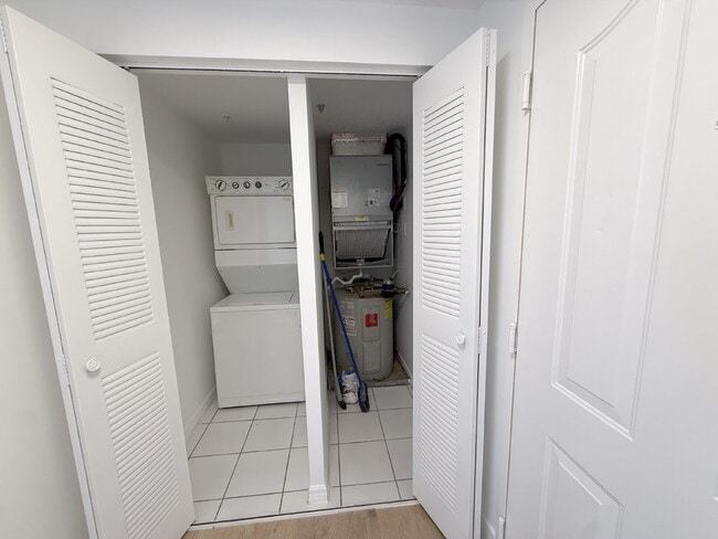 Building Photo - Rare 2/2 Corner Penthouse with Panoramic Lagoon Views from Every Room – Available Now!