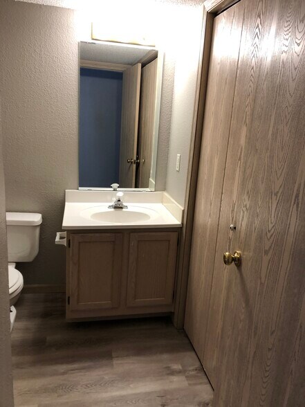 main level half bath with laundry hookups - 1007 Toulouse St