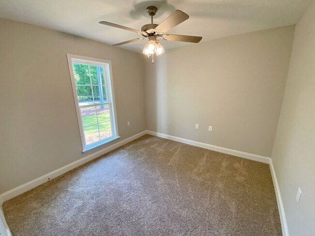 Building Photo - $500 Move-in Discount! Modern 4-Bedroom Home with Fenced Yard Near Moody AFB