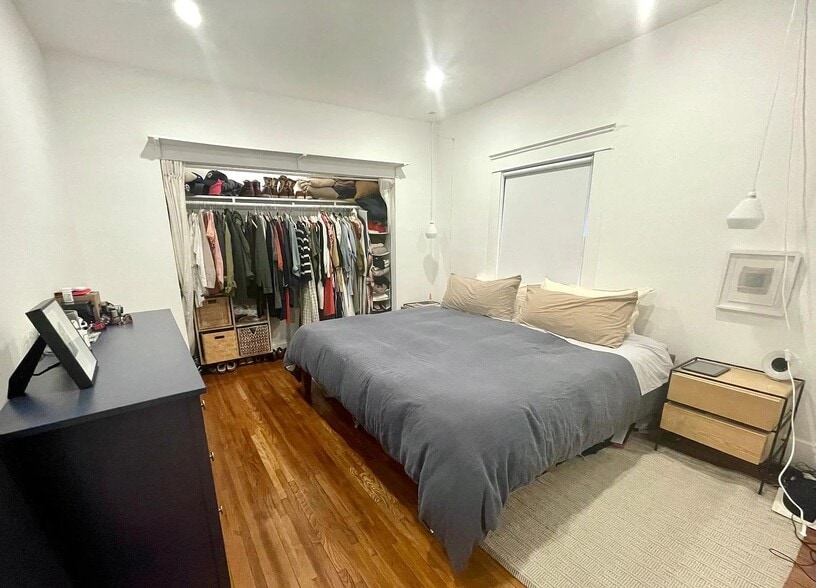 Comfortable and quiet primary bedroom with space for a king bed. - 6000 Carlton Way