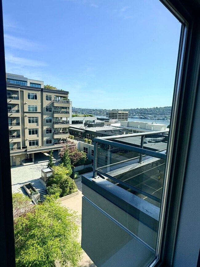 Building Photo - Top-Floor 2BR with Lake Union Views + Garage Parking + Internet Included!